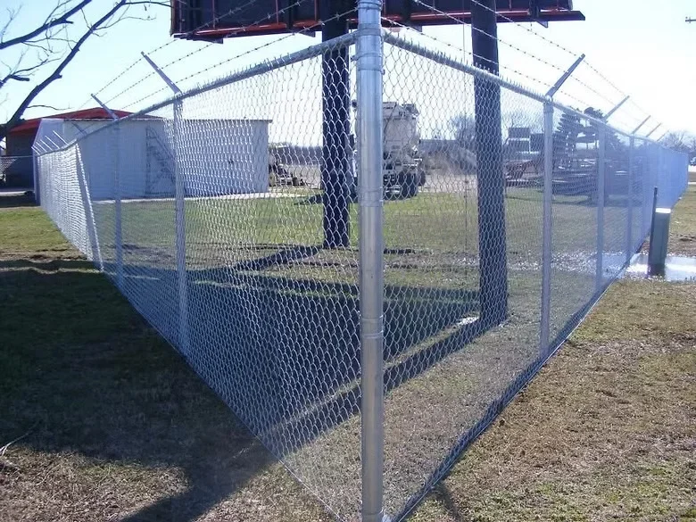 Galvanized steel chain link fence enclosure with metal posts and gate